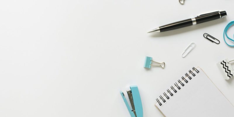 top-view-office-stationery-with-pen-notebook